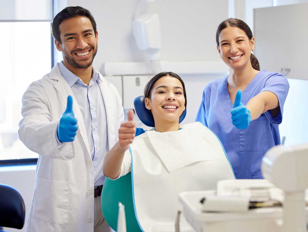 Oral Surgeon, Patient and Dental Hygienist at oral surgery consultation