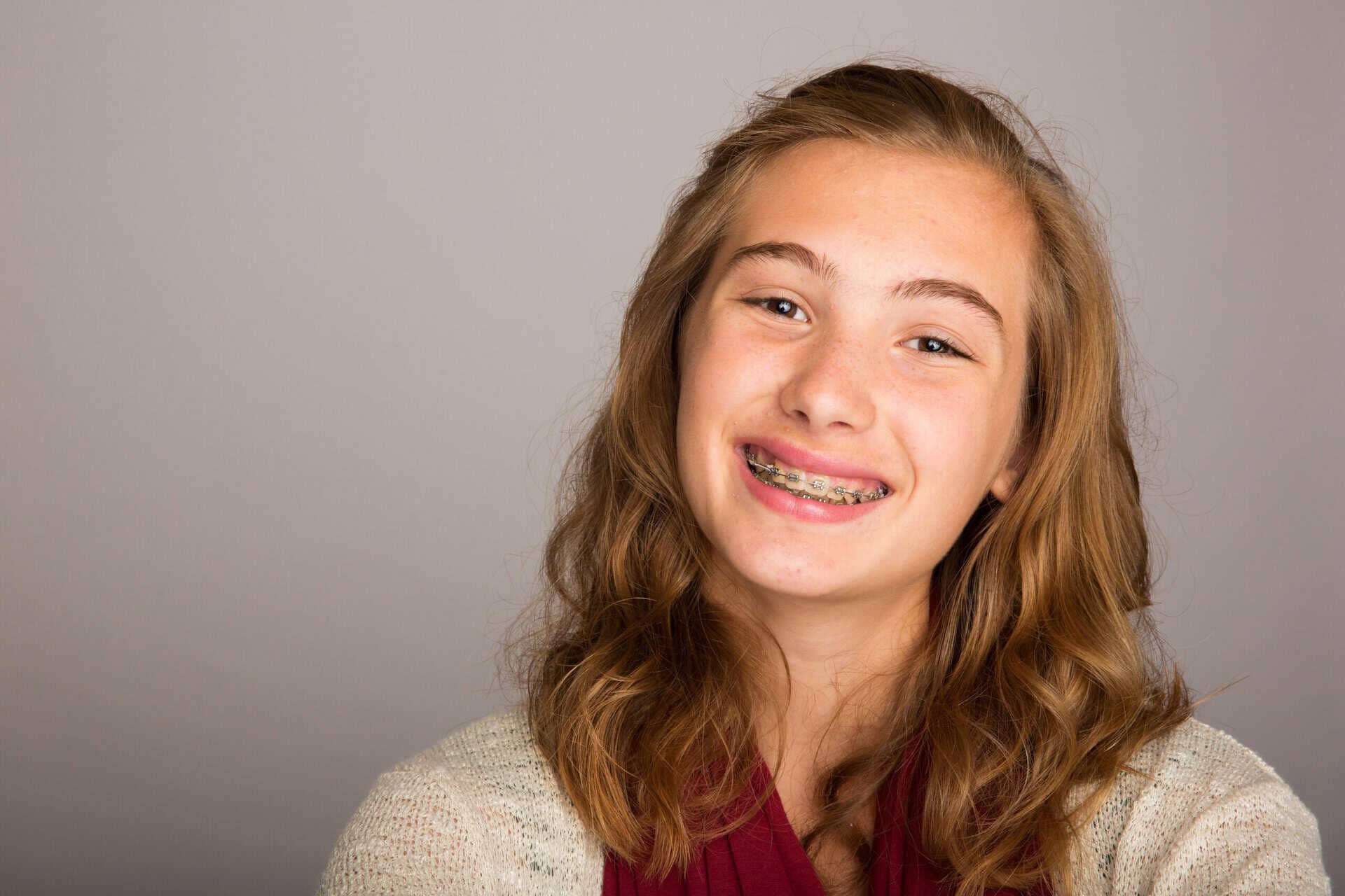 happy teenage girl wearing braces